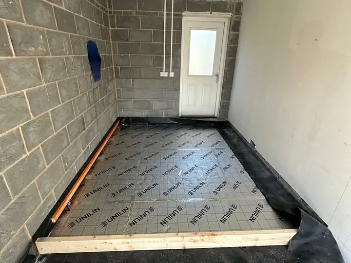 Insulated floor being laid in a garage