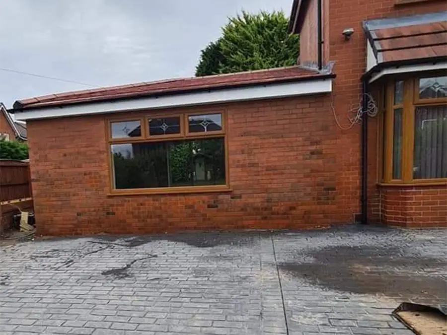 Attached side garage converted with a new window